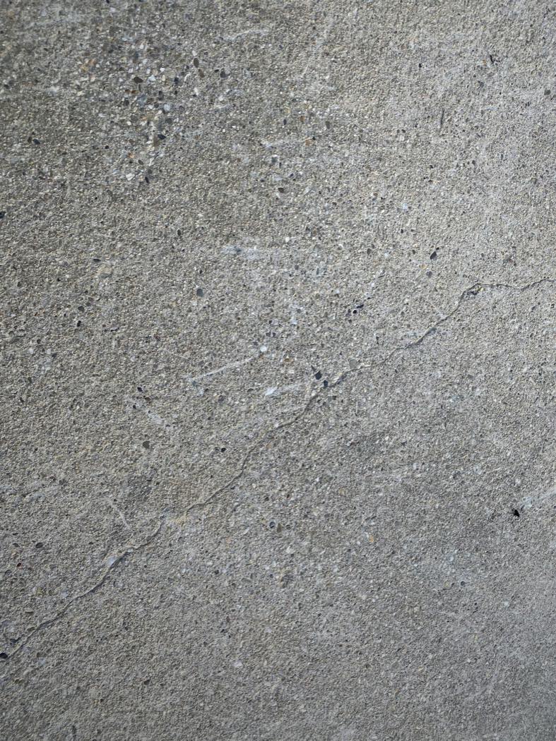Close-up of off-white concrete-look porcelain with a fine grain