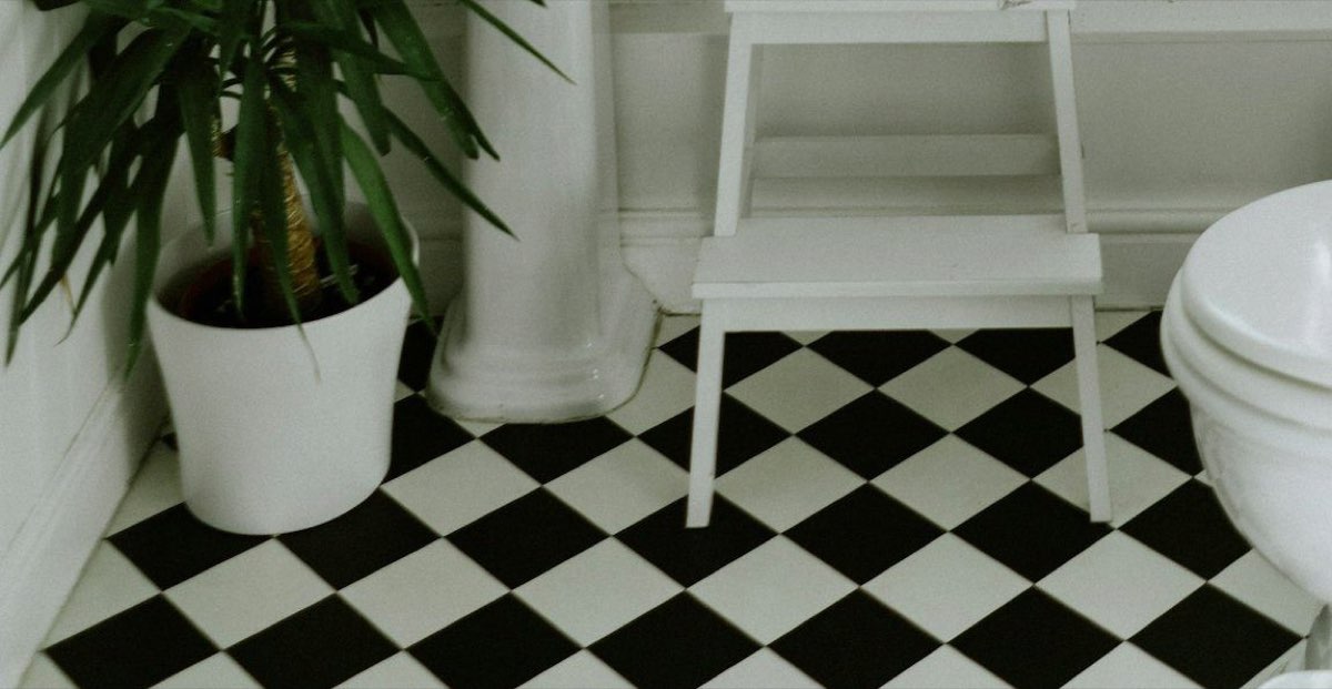 Close-up of a black-and-white chequerboard tiled floor